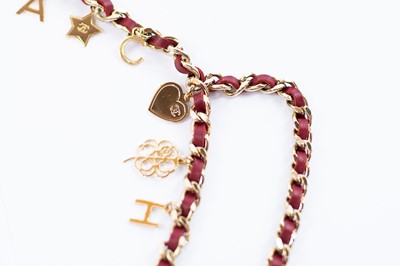 Lot 403 - Chanel belt. Champagne gold plated 'Charms'.