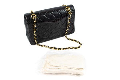 Lot 386 - A Chanel Double Flap handbag in black lambskin with gold tone hardware.