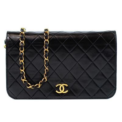 Lot 384 - A Chanel wallet full flap handbag on chain in black quilted lambskin with gold tone hardware.