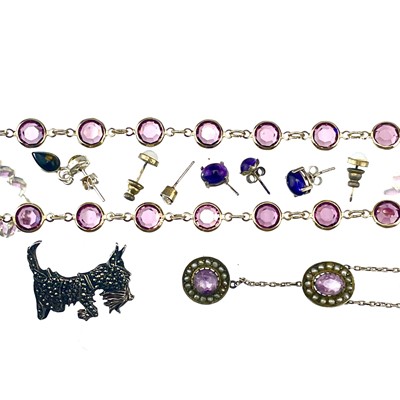 Lot 240 - A gold plated 'amethyst' set Riviere necklace.