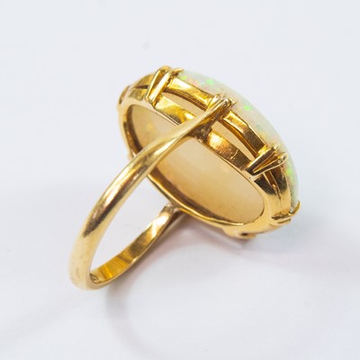 Lot 105 - An 18ct gold white opal set ring.