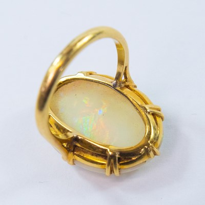 Lot 105 - An 18ct gold white opal set ring.