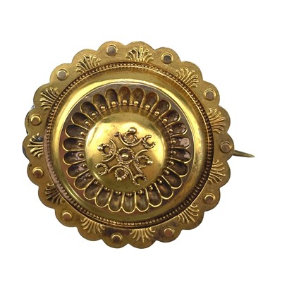 Lot 35 - A Victorian 15ct hallmarked gold circular target brooch.