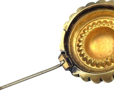 Lot 35 - A Victorian 15ct hallmarked gold circular target brooch.