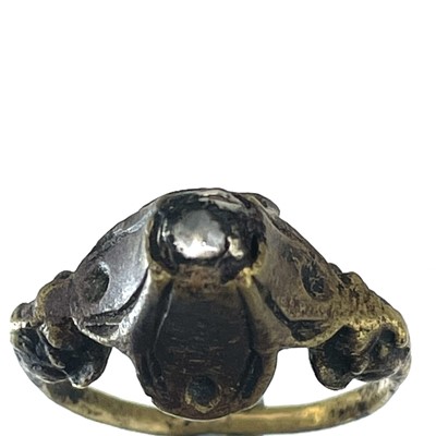 Lot 181 - An interesting, probably 16th century, bronze white stone set ring, size L, 5.3g.