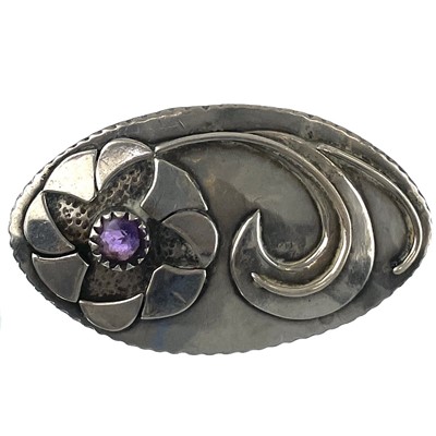 Lot 254 - A Modernist silver oval brooch.