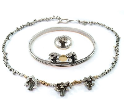 Lot 288 - A contemporary silver and gold bracelet, ring and necklace.