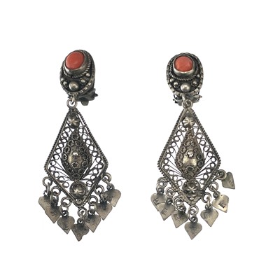 Lot 253 - A pair of middle eastern silver filigree coral set drop clip earrings.