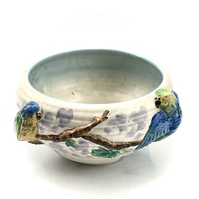 Lot 907 - A Clarice Cliff bowl, moulded with two parrots...