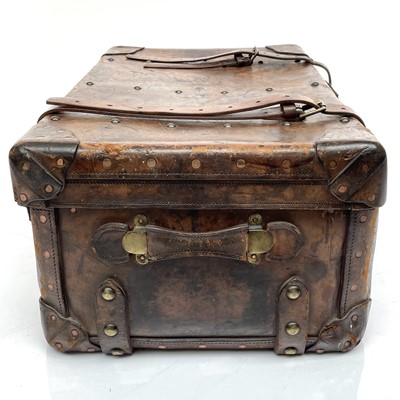 Lot 1890 - An early 20th century leather luggage case...