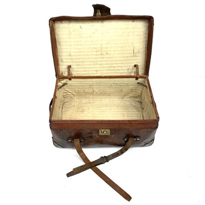 Lot 1890 - An early 20th century leather luggage case...