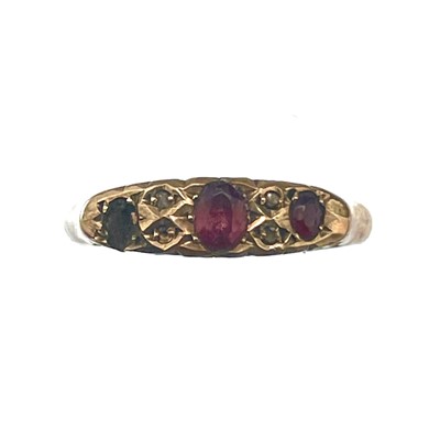 Lot 100 - A 9ct rose gold diamond and garnet ring.