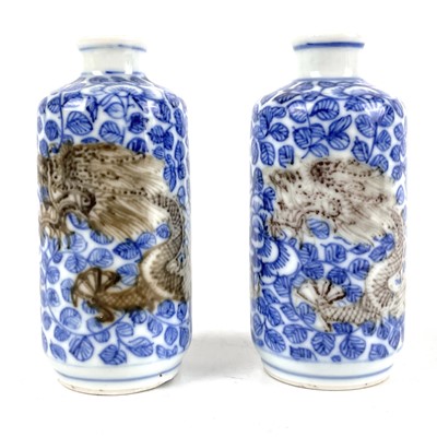 Lot 290 - A pair of Chinese blue and copper red porcelain snuff bottles, 19th century.