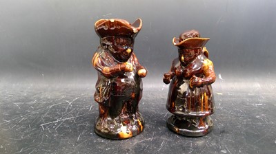 Lot 42 - Toby and Sairy Gamp treacle glaze jugs, Height...
