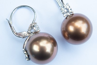 Lot 147 - A pair of contemporary cultured bronze pearl and diamond earrings.
