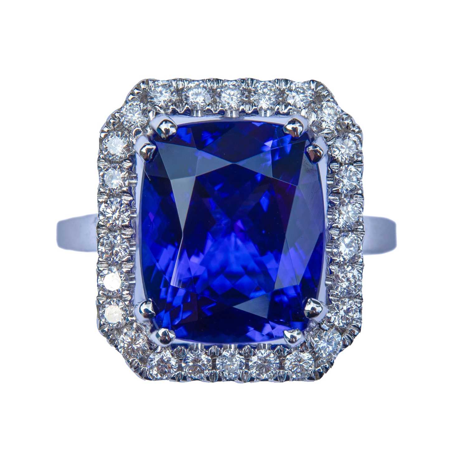 Lot 3 - An 18ct white gold tanzanite and diamond cluster ring