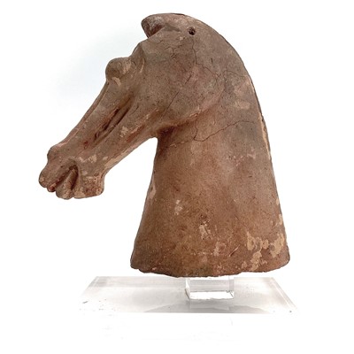 Lot 330 - A Chinese pottery horse head possibly Tang period.