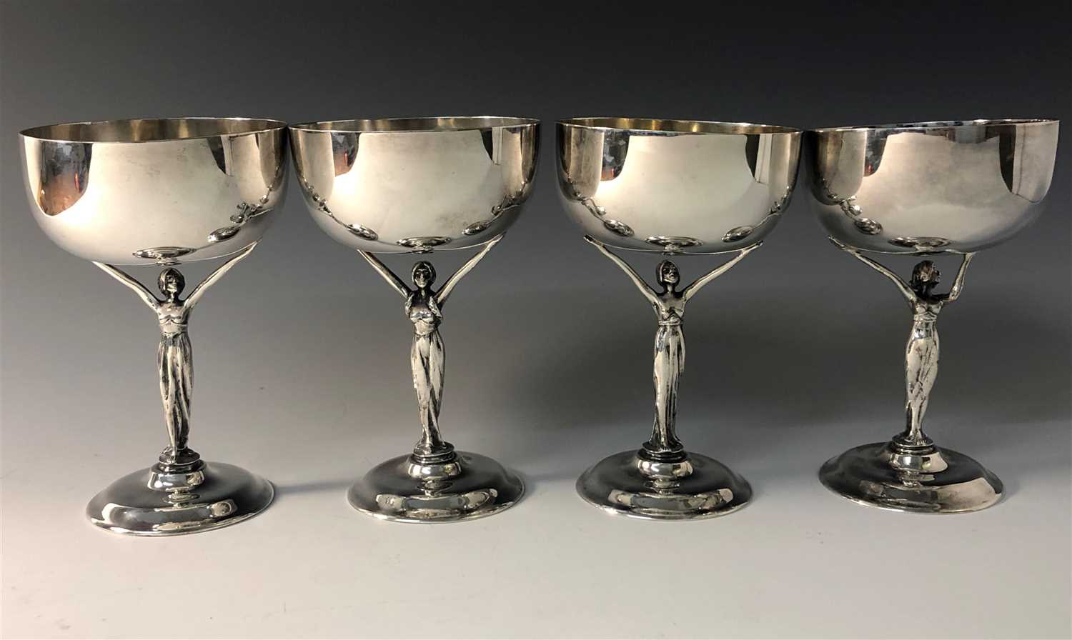 Lot 2067 - A set of four silver Art Nouveau goblets by...