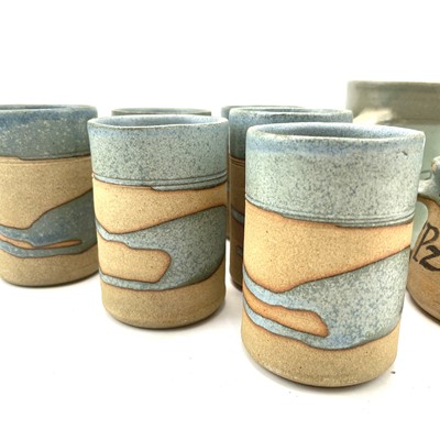 Lot 835 - Alan Brough, A set of six cylindrical beakers,...