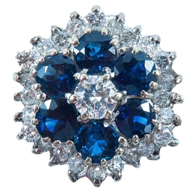 Lot 159 - A diamond and sapphire cluster ring