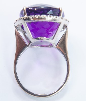 Lot 168 - An 18ct white gold amethyst and diamond cluster dress ring.