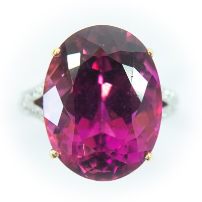 Lot 50 - An 18ct white and yellow gold pink topaz dress ring.