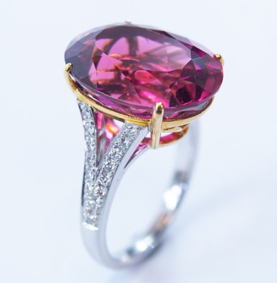 Lot 50 - An 18ct white and yellow gold pink topaz dress ring.