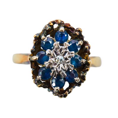 Lot 207 - A 1970's 18ct gold diamond and sapphire cluster ring