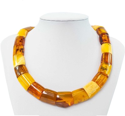 Lot 228 - A contemporary multi-coloured amber panel bead necklace with gold plated button clasp.
