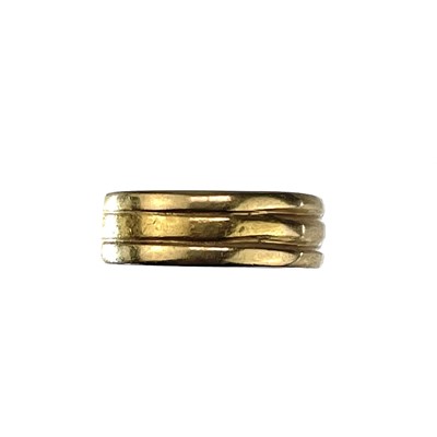 Lot 128 - A 22ct hallmarked gold triple band ring.