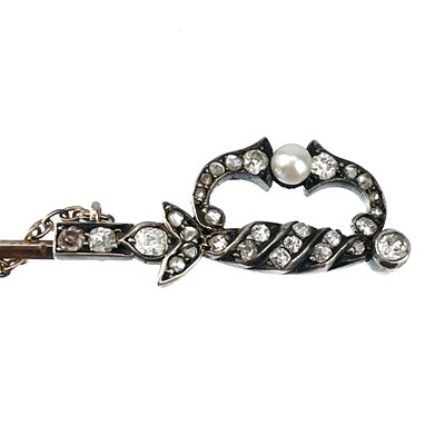 Lot 216 - A Victorian gold, white metal and diamond and pearl set jabot pin in the form of a sword.