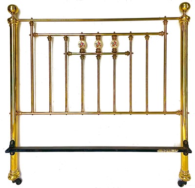 Lot 1819 - A Victorian style brass bed head and end.