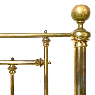 Lot 1932 - A Victorian style brass bed head and end.