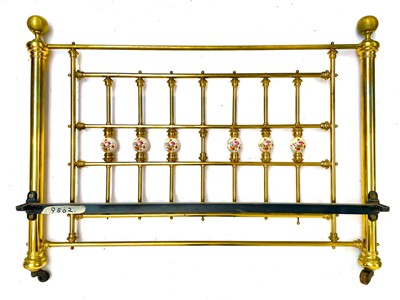 Lot 1819 - A Victorian style brass bed head and end.