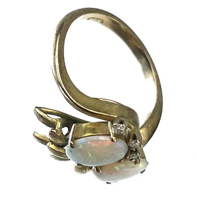 Lot 97 - A 14ct gold opal and diamond set six stone ring.