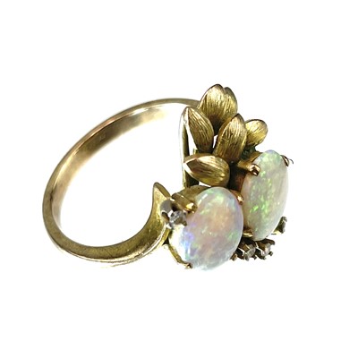 Lot 97 - A 14ct gold opal and diamond set six stone ring.