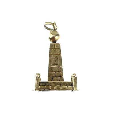 Lot 57 - An 18ct gold charm in the form of an obelisk.