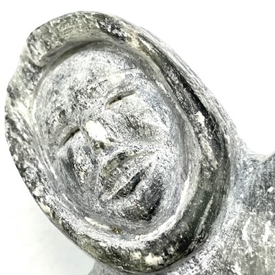 Lot 26 - An Inuit soapstone carving of a standing woman...