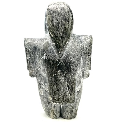 Lot 26 - An Inuit soapstone carving of a standing woman...