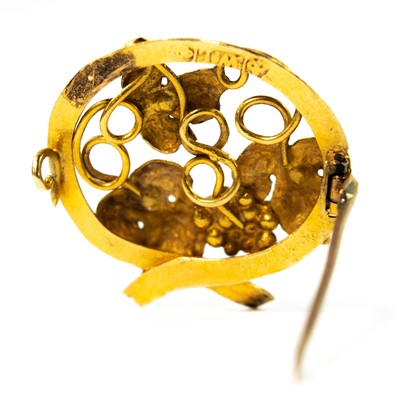 Lot 114 - A late 19th century gold fruiting vine openwork brooch.