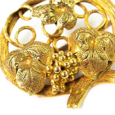 Lot 114 - A late 19th century gold fruiting vine openwork brooch.