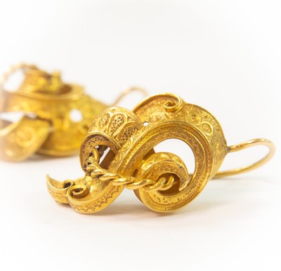 Lot 102 - A pair of Victorian high purity gold scroll shaped openwork earrings.