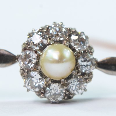 Lot 83 - A gold and platinum diamond and pearl cluster set bar brooch.