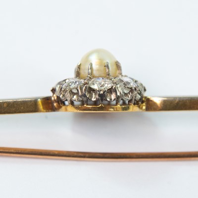 Lot 83 - A gold and platinum diamond and pearl cluster set bar brooch.