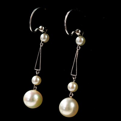 Lot 187 - A pair of early 20th century 9ct white gold and pearl drop earrings.