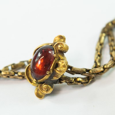 Lot 108 - A Victorian gold carbuncle garnet set heart shaped pendant locket and chain.