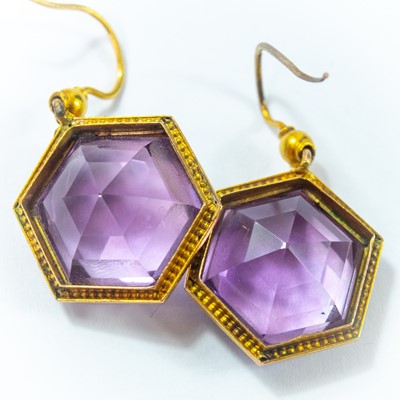 Lot 53 - A pair of Victorian yellow metal mounted hexagonal cut amethyst earrings.