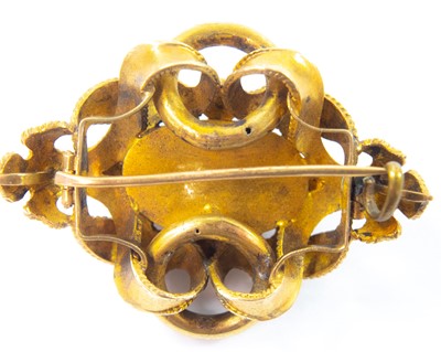 Lot 64 - A Victorian gold carbuncle brooch.
