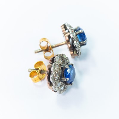 Lot 127 - A pair early 20th century rose gold diamond and sapphire cluster stud earrings.