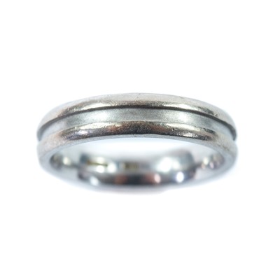 Lot 188 - A modern 18ct hallmarked white gold band ring.